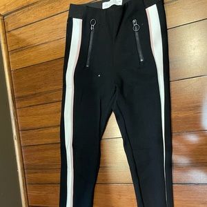 Black pants with pink and white stripes on the side